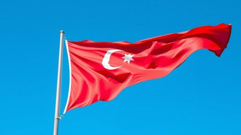 Azerbaijani flag waving against a clear blue sky, symbolizing diplomacy and international relations.